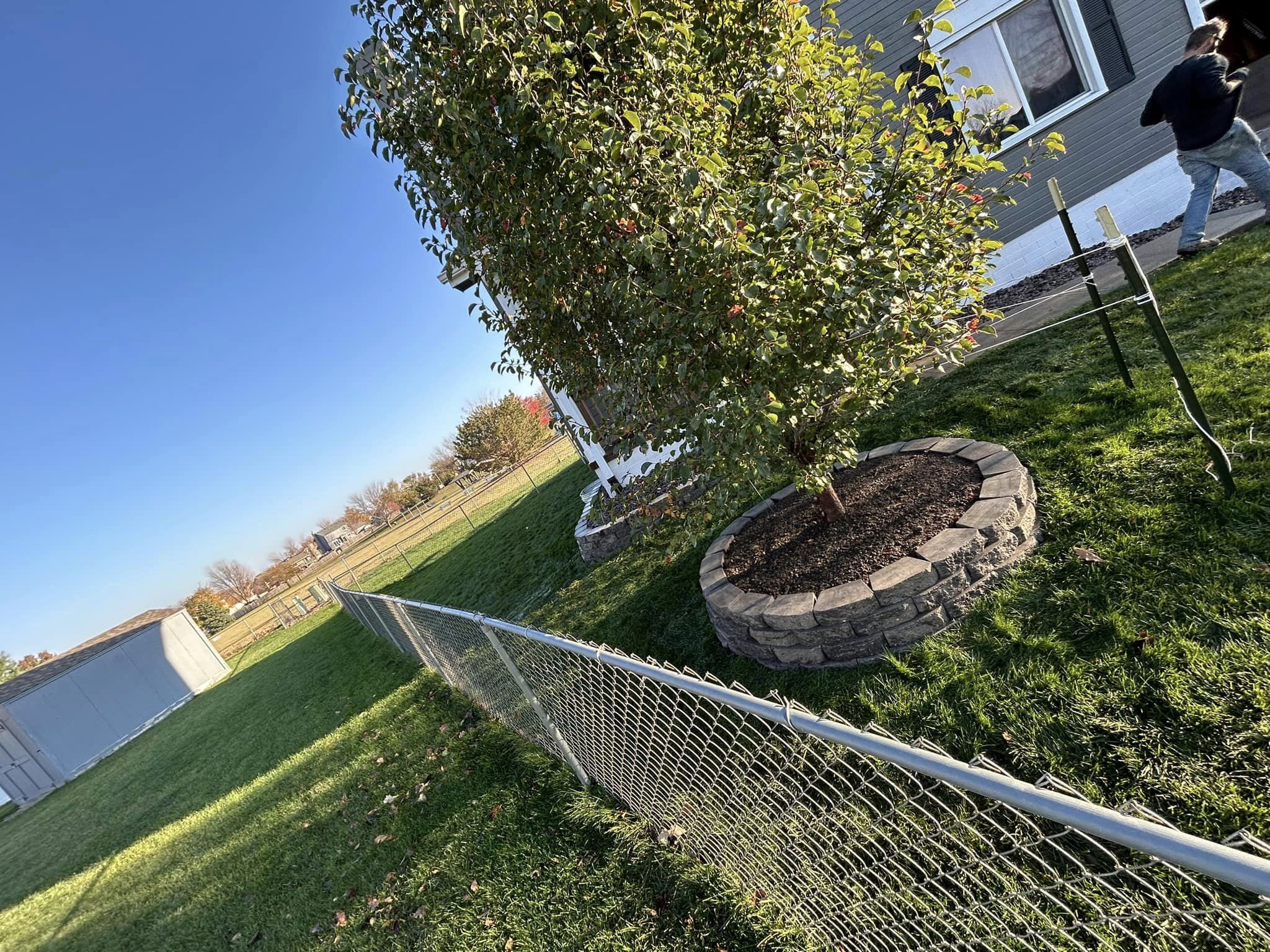 Retaining wall installation by expert Omaha landscaping companies.